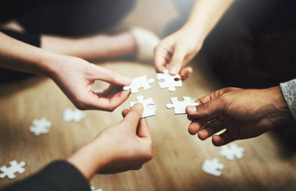 Hands holding Puzzles pieces